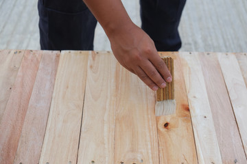 A carpenter with lacquer paint