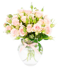 Bouquet of pink blooming fresh roses with buds in vase isolated on white background