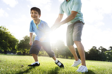 Obraz premium Soccer Football Field Father Son Activity Summer Concept