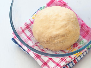 Cooking process. Preparing dough for cakes, pastries, buns or pizza. Leavened dough in transparent...