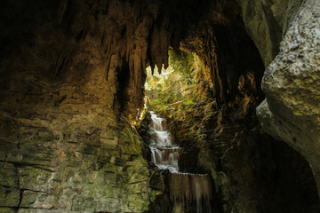 Cave and waterfall in the park of Paris