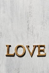 Wooden love on white wood background, outdoor day light