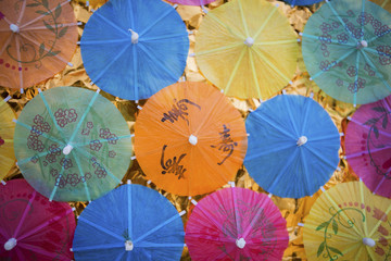 Summer concept idea, colorful paper umbrella background