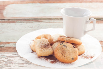 Fresh cookies on rustic wooden table.