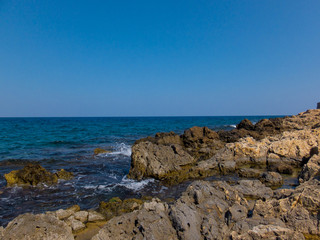 Fototapeta na wymiar Mediterranean rocky beach in Greece