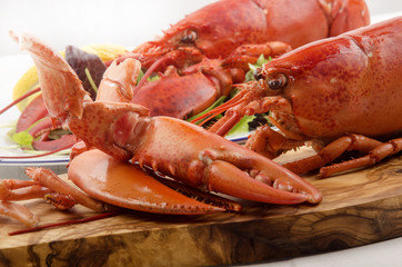 freshly cooked lobster on a wooden board