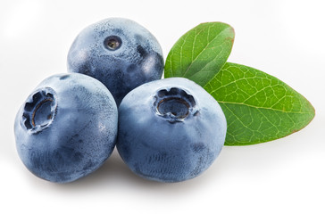 Ripe blueberries on the white background. © volff