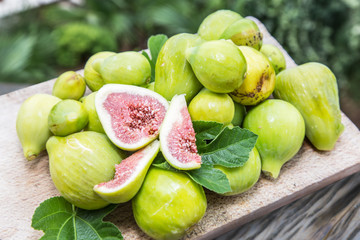 Ripe fig fruits on the wooden table.