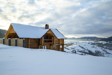Wooden Home in the mountains. Winter Carpathian mountains 