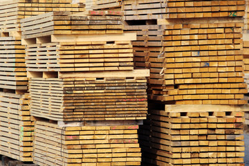 stock of wood planks on the factory yard