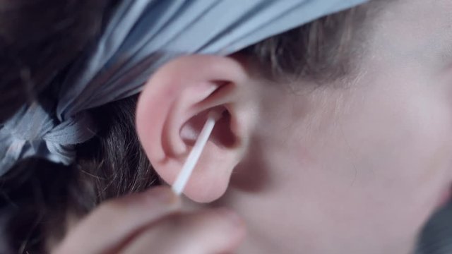 4k Close Up Child Ear Cleaning it with a Clean Pad