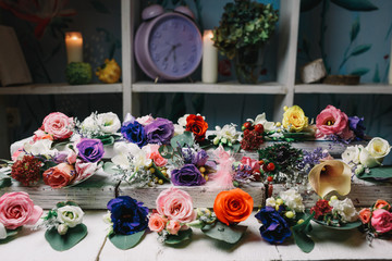 Different kinds of boutonnieres lie on white steps