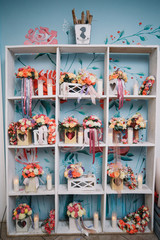 White wardrobe with rose bouquets in boxes