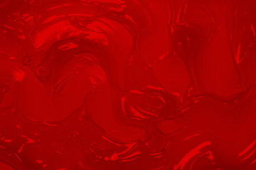 Abstract background of the red cream with splatters