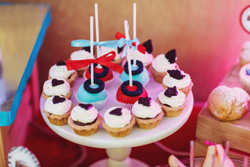 Sweet balls and baked basckets on round plate