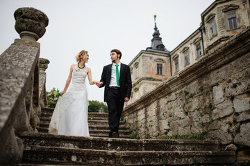 Loving wedding couple at their happy wedding day background old