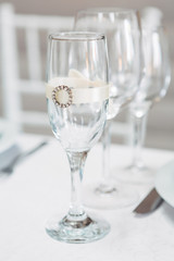 Champagne flute decorated with silk ribbon and brooch
