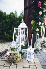Decorative lantern with bouquet of roses inside