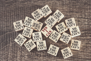 Positivity and decision making concept with Yes and No words on wooden blocks