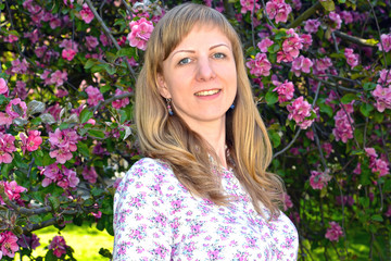 The young woman against the background of the blossoming Nedzvet