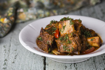 Meat ribs with tomato sauce