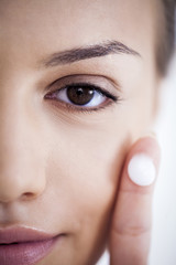Woman Applying Face Cream
