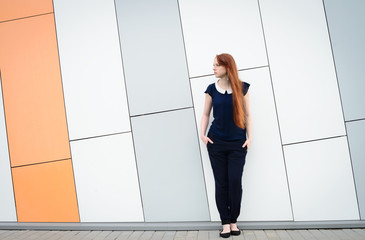 redhair woman with freckles outside office break