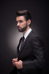 profile young man handsome elegant suit hands black