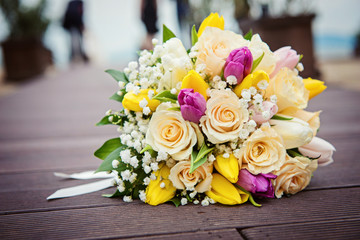 Yellow and pink roses. Wedding bouquet