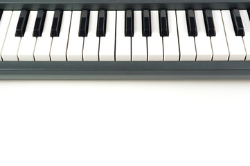 Electronic Piano Keyboard detail close up on white background with copy space