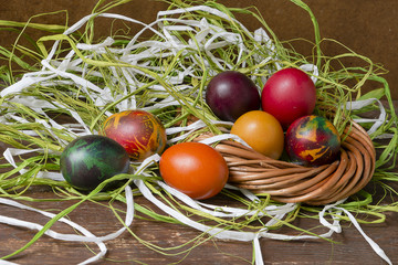 Colorful Easter eggs on wooden table