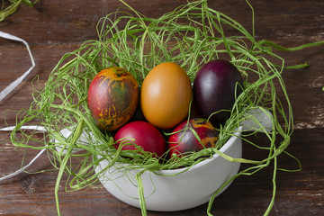 Colorful Easter eggs on wooden table