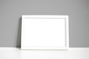 A4 white landscape frame with grey wall