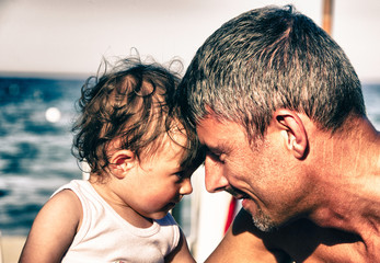 Baby and her Father playing at Seaside in Sicily