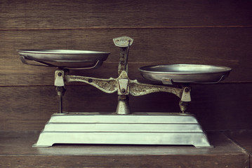 Vintage balance on wood background
