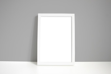 A4 white portrait frame with grey wall