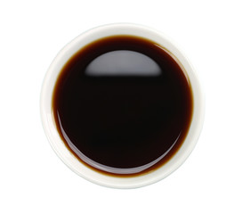 Soy sauce in white bowl isolated on background