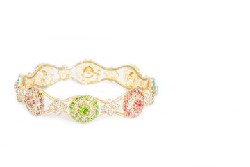 Gold bracelets with gem and diamonds isolate on white background.