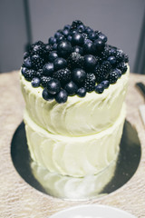 The birthday cake stands on the table