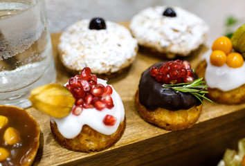 Beautiful tasty cakes on the table close-up