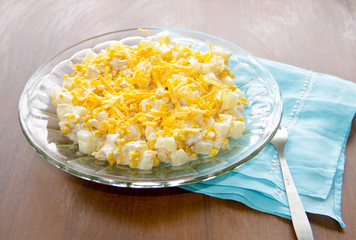 Festive salad with chicken breast, sweet corn, cheese and pineapple