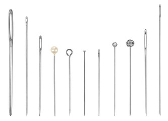 A set of sewing needles and pins closeup on isolated white backg