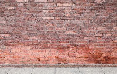 Fototapeta premium Red brick wall and concrete floor