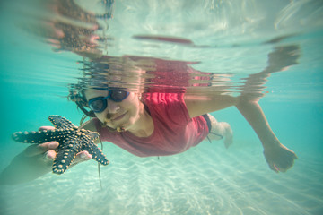 Young woman enjoying reef in Indian Ocean