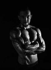 Fototapeta premium Strong athletic man showes naked muscular body