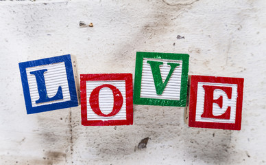 Fototapeta premium Word “LOVE” on old wood background.