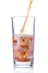 Pouring cola in glass on white background