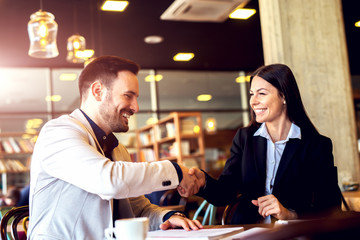 Business people at cafe making a deal.