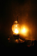 Old kerosene lamp in a dark old building.