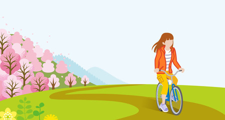 Naklejka premium Woman Cycling in Springtime - Long hair